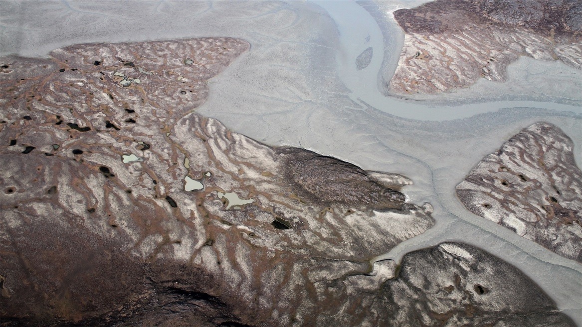 Luftfoto af gletsjermel i Grønland